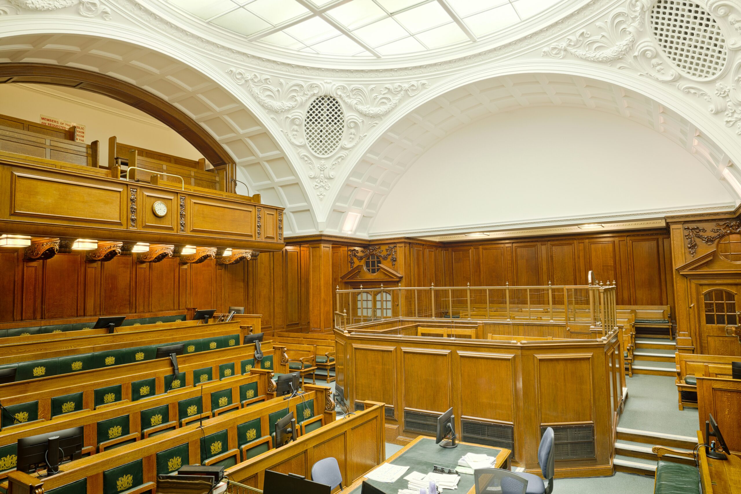 Wooden courtroom benches in an empty court; illustrative image for reporting on a court ruling.