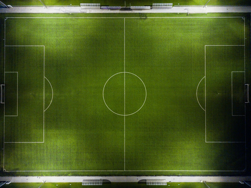 Aerial view of a football pitch, used as general tactical context for the match.
