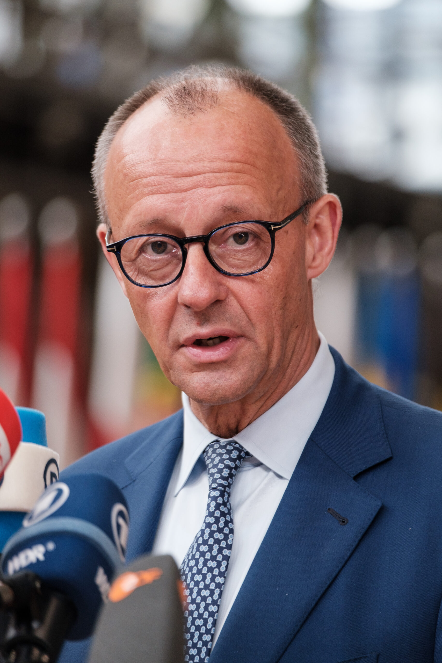 German Chancellor Friedrich Merz, representing governments concerned about the cost of the proposed EU budget