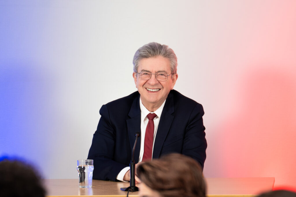 Jean-Luc Melenchon with his full face and upper body visible at a public event in May 2026.