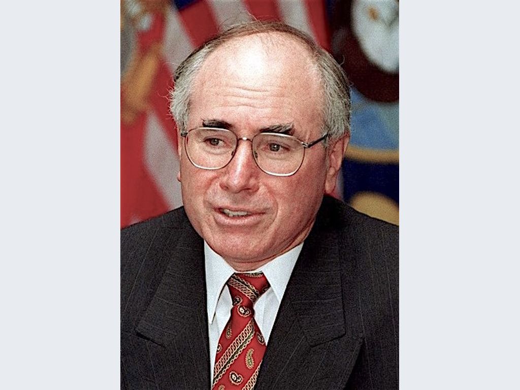 Archival photograph of former Australian prime minister John Howard during a 1997 meeting, not an image from the October 2026 rally.