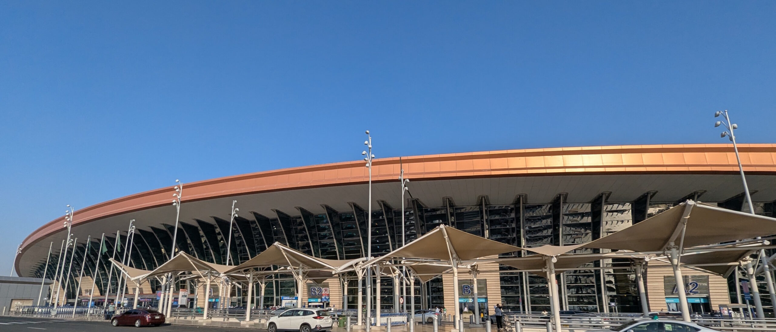 Exterior entrance and departures area of King Abdulaziz International Airport Terminal 1 in Jeddah, Saudi Arabia.