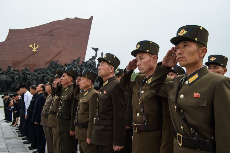 North Korean service personnel salute in Pyongyang on October 10, 2026