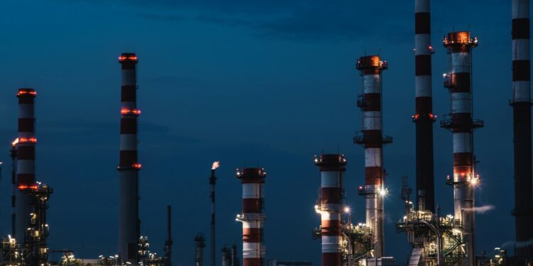 Illustrative view of an oil refinery with processing towers, pipes and industrial infrastructure