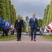 French Prime Minister Sébastien Lecornu walking alongside U.S. Defense Secretary Pete Hegseth during a ceremony in Normandy in June 2025.